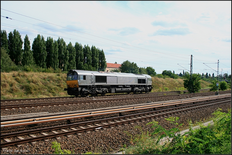 Deutsche Gleisbau Material Transport 6604, angemietet von CB Rail, fuhr solo am 31.07.2009 Richtung Karower Kreuz durch das Nordkreuz an der Bornholmer Straße in Berlin (NVR-Nummer 9280 1266 014-0 D-DGMT)